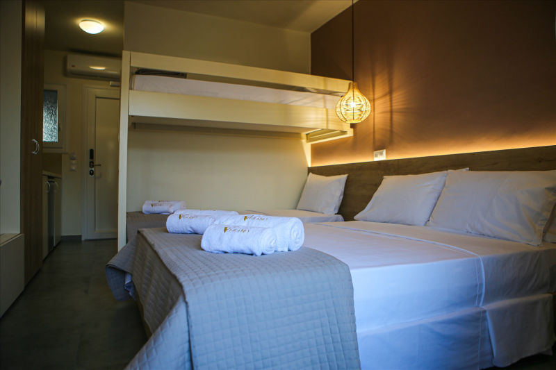 Overview of room with double bed and bunk bed